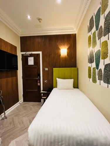 Habitación Individual del hotel Cheshire Central London. Foto 10