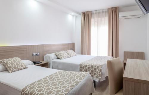 Habitación Triple del hotel Olympia Ronda Ii. Foto 8