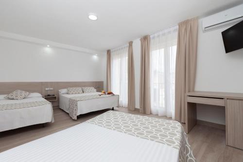 Habitación Cuádruple del hotel Olympia Ronda Ii. Foto 1
