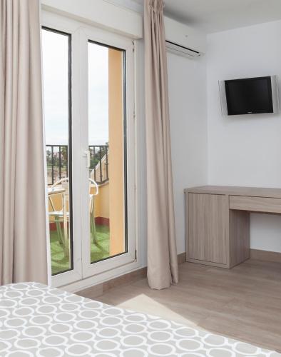 Habitación Doble con Terraza del hotel Olympia Ronda Ii. Foto 10