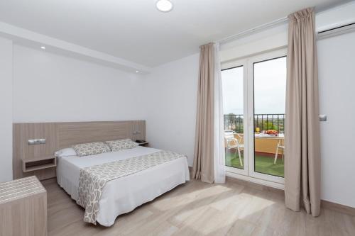 Habitación Doble con Terraza del hotel Olympia Ronda Ii. Foto 12