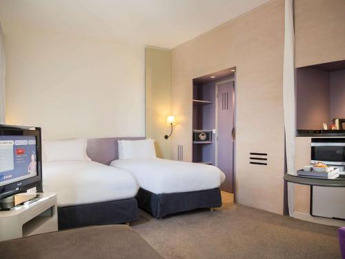 Habitación Doble Superior con sofá - 2 camas del hotel Novotel Marrakech Hivernage. Foto 5