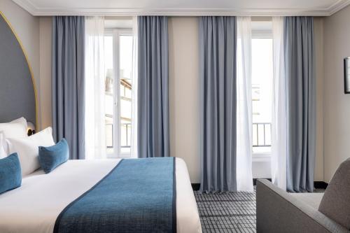 Habitación Triple acogedora del hotel De France Gare de Lyon Bastille. Foto 3