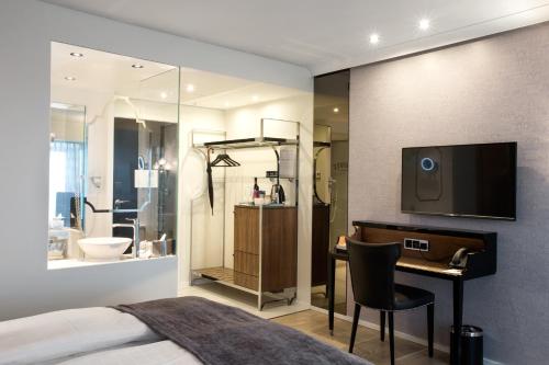 Habitación Deluxe con cama extragrande del hotel Tivoli. Foto 1