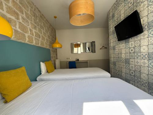 Habitación Doble - 2 camas del hotel Le Régent Montmartre By Hiphophostels. Foto 3