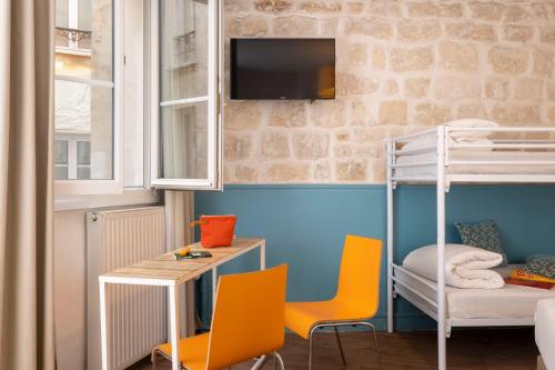 Habitación cuádruple del hotel Le Régent Montmartre By Hiphophostels. Foto 1