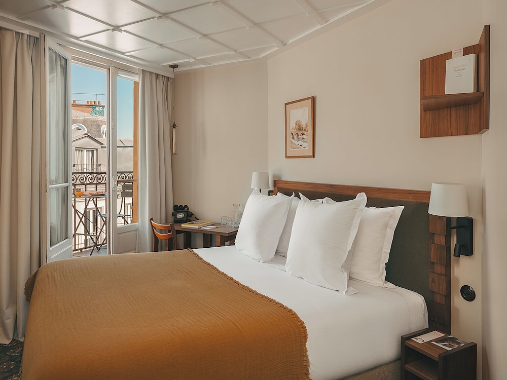 Habitación clásica doble, balcón del hotel Hôtel Le Petit Belloy St Germain. Foto 5