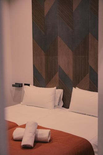 Habitación con 2 camas individuales - Planta baja del hotel Nochela Sevilla. Foto 11