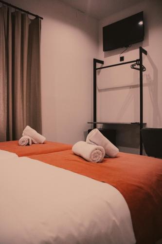 Habitación con 2 camas individuales - Planta baja del hotel Nochela Sevilla. Foto 12