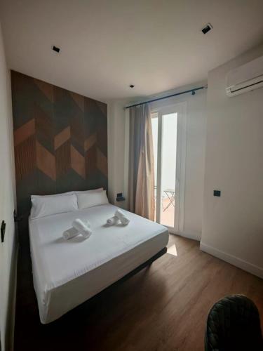 Habitación Doble con patio del hotel Nochela Sevilla. Foto 5