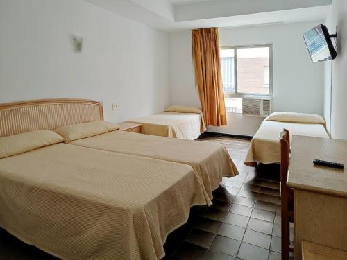 Habitación cuádruple del hotel Porto. Foto 2