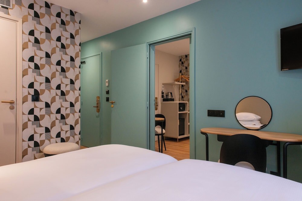Habitación familiar del hotel Arc Elysees. Foto 1