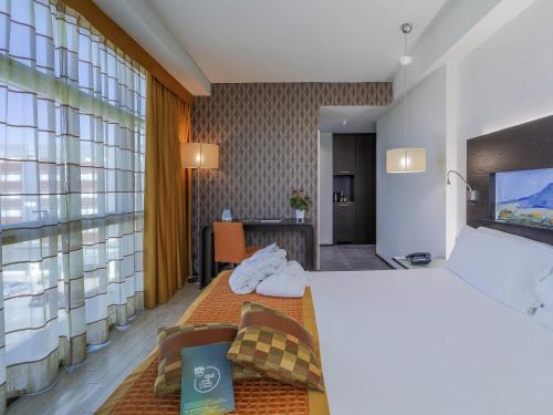 Habitación Doble Deluxe del hotel Mercure Siracusa Prometeo. Foto 7