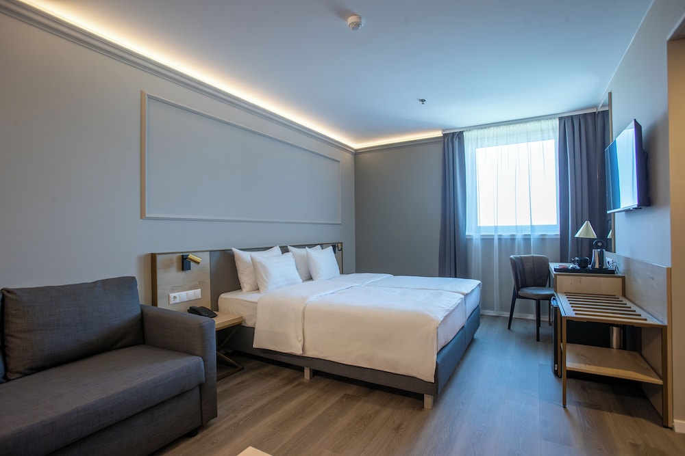 Habitación superior con 1 cama doble o 2 individuales del hotel Expo Tower by Mellow Mood Hotels