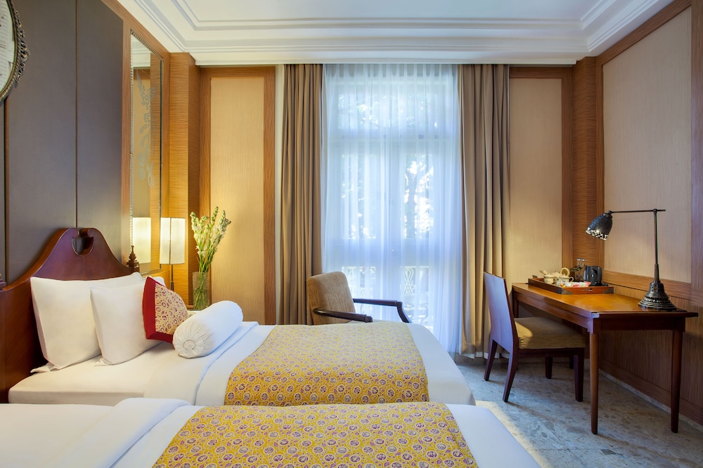 Superior Heritage, cama queen size o dos camas individuales del hotel The Phoenix Hotel Yogyakarta - Handwritten Collection. Foto 3