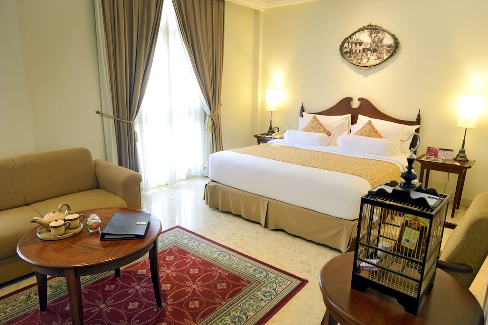 Phoenix Executive, cama king size del hotel The Phoenix Hotel Yogyakarta - Handwritten Collection. Foto 3