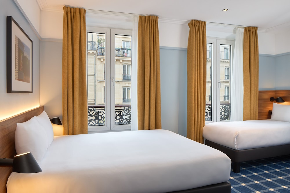 Habitación triple del hotel Timhotel Paris Gare Du Nord. Foto 2