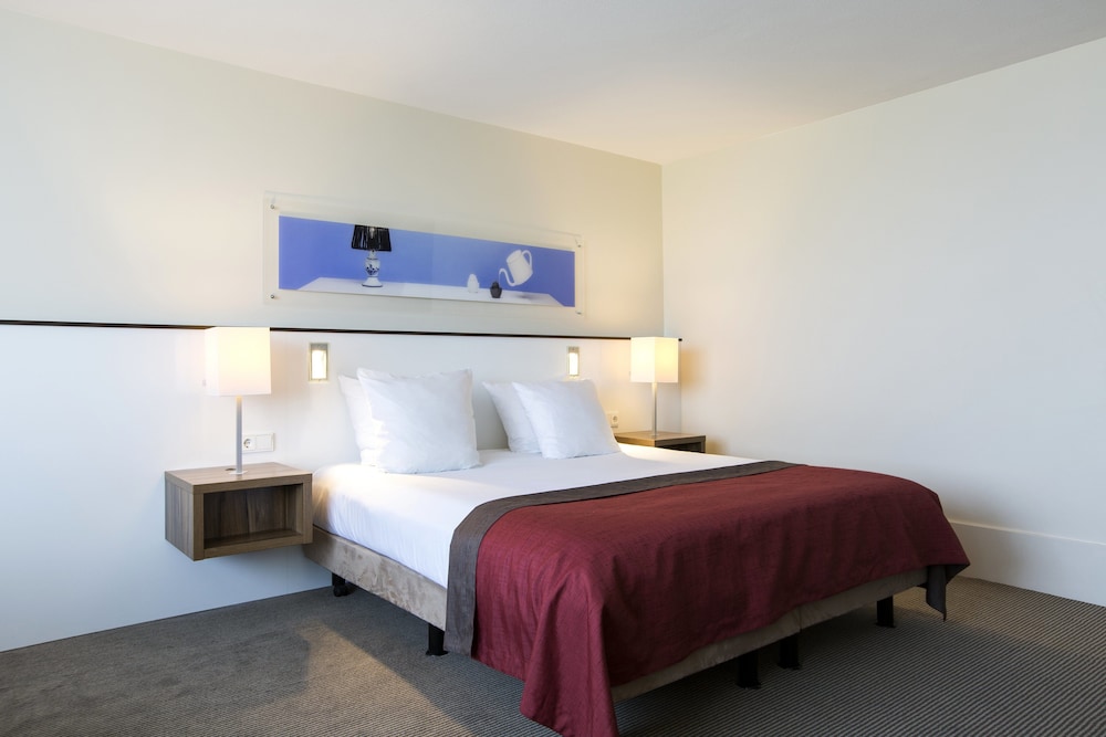 Suite, 1 cama de matrimonio grande con sofá cama del hotel Holiday Inn Eindhoven Centre, An Ihg