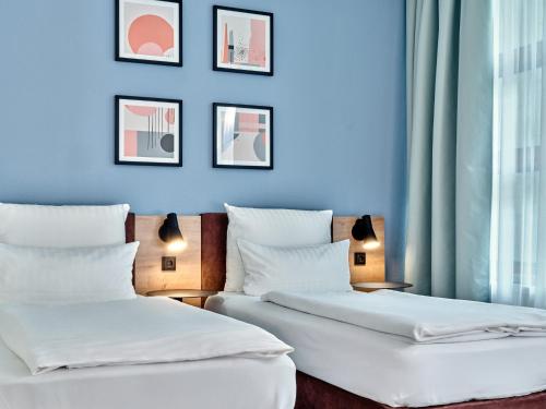 Premium Room with Three Single Beds - Up to Three Adults del hotel Garner Hotel Berlin - Schöneberg, an IHG. Foto 3