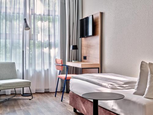 Premium Room with Three Single Beds - Up to Three Adults del hotel Garner Hotel Berlin - Schöneberg, an IHG. Foto 4