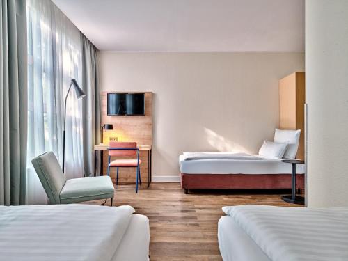 Premium Room with Three Single Beds - Up to Three Adults del hotel Garner Hotel Berlin - Schöneberg, an IHG. Foto 5