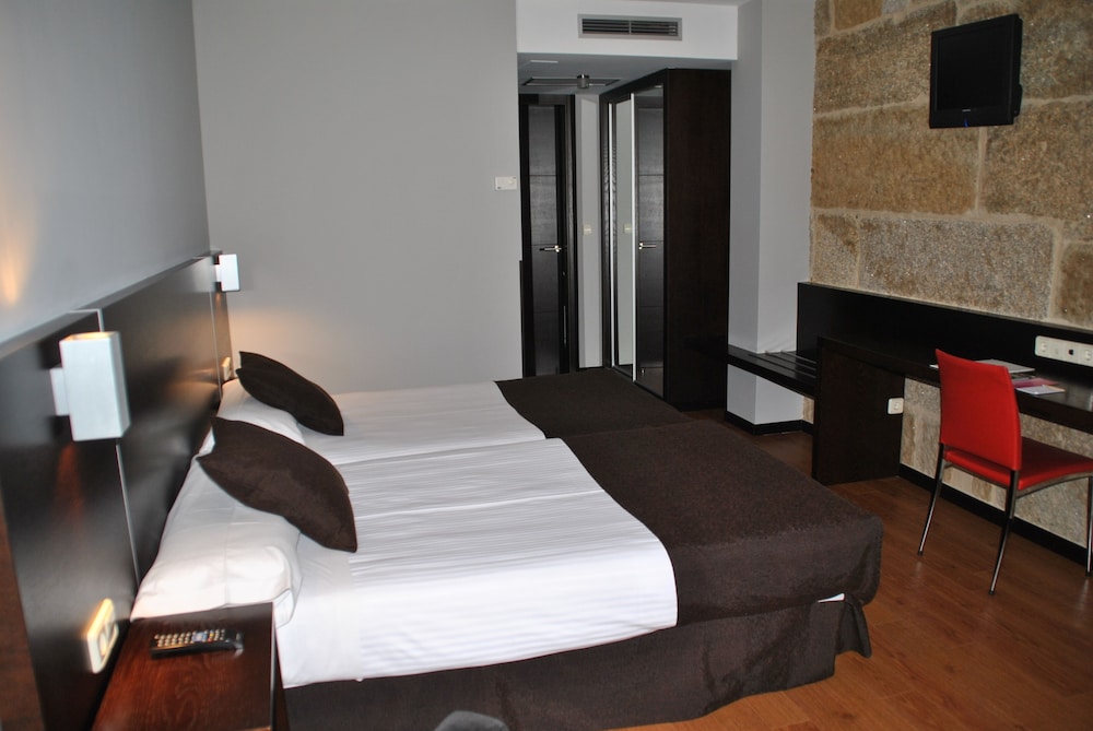 Habitación con 1 cama doble o 2 individuales del hotel Junquera. Foto 1