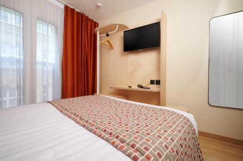 Habitación Doble Estándar del hotel VLH Montparnasse Eiffel. Foto 7