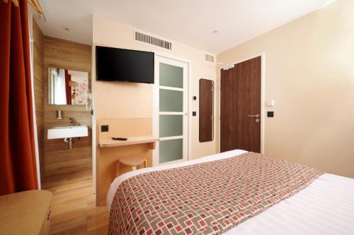 Habitación Deluxe del hotel VLH Montparnasse Eiffel. Foto 8