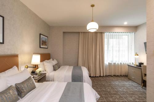 Habitación Doble Deluxe - 2 camas dobles del hotel Broadway Plaza. Foto 7