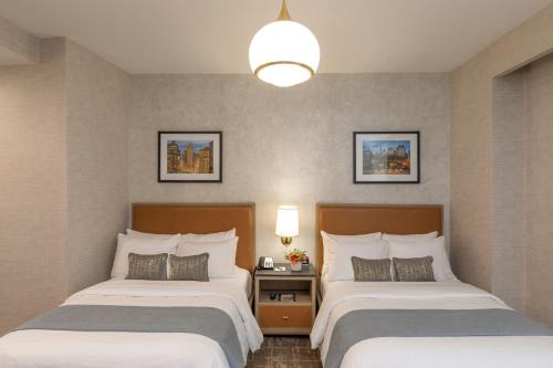 Habitación Doble Deluxe - 2 camas dobles del hotel Broadway Plaza. Foto 8