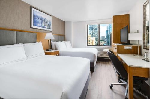 Habitación Doble con vistas - 2 camas dobles del hotel Doubletree By Hilton New York City - Chelsea. Foto 4