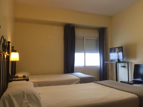 Habitación Doble Estándar - 1 o 2 camas del hotel Orfebre Góngora. Foto 12
