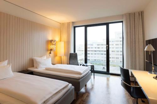 Habitación Doble - 2 camas del hotel Scandic Berlin Potsdamer Platz. Foto 2