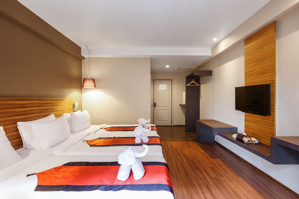 Superior Triple Room With Two Ways Airport Transfer del hotel The Cottage Suvarnabhumi. Foto 3