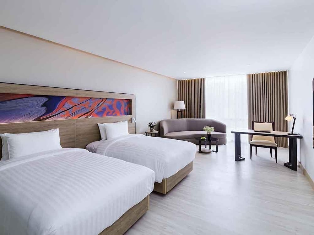 Habitación Ejecutiva con Dos Camas Individuales del hotel Novotel Phuket City Phokeethra - Sha Extra Plus. Foto 4