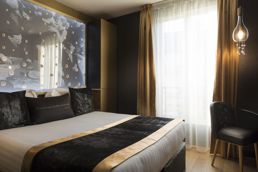 Habitación clásica del hotel Les Bulles de Paris. Foto 1