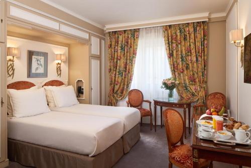 Habitación Clásica del hotel Majestic Spa Paris. Foto 1