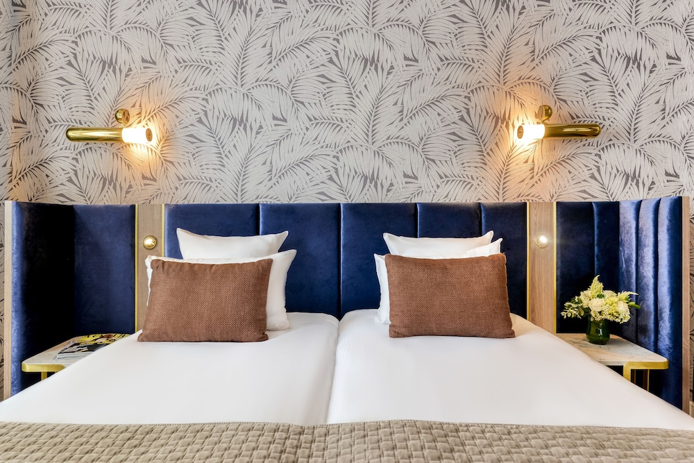 Habitación superior con 2 camas individuales del hotel Opéra Opal. Foto 1