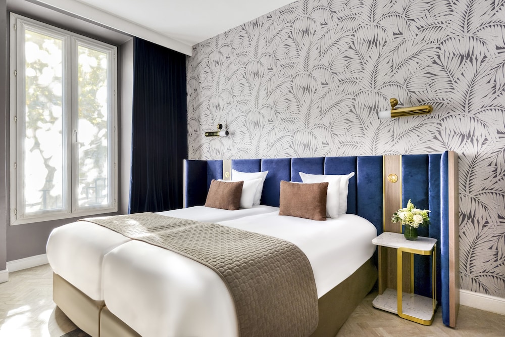 Habitación superior con 2 camas individuales del hotel Opéra Opal. Foto 2