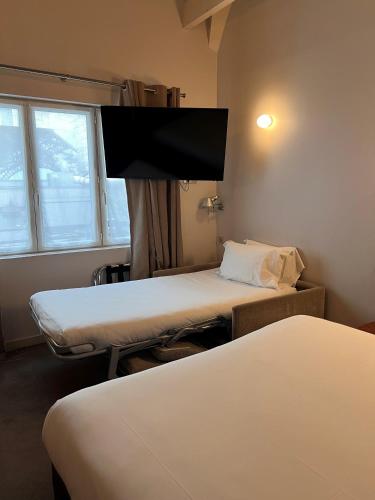 Habitación Triple Estándar del hotel Cadran. Foto 5