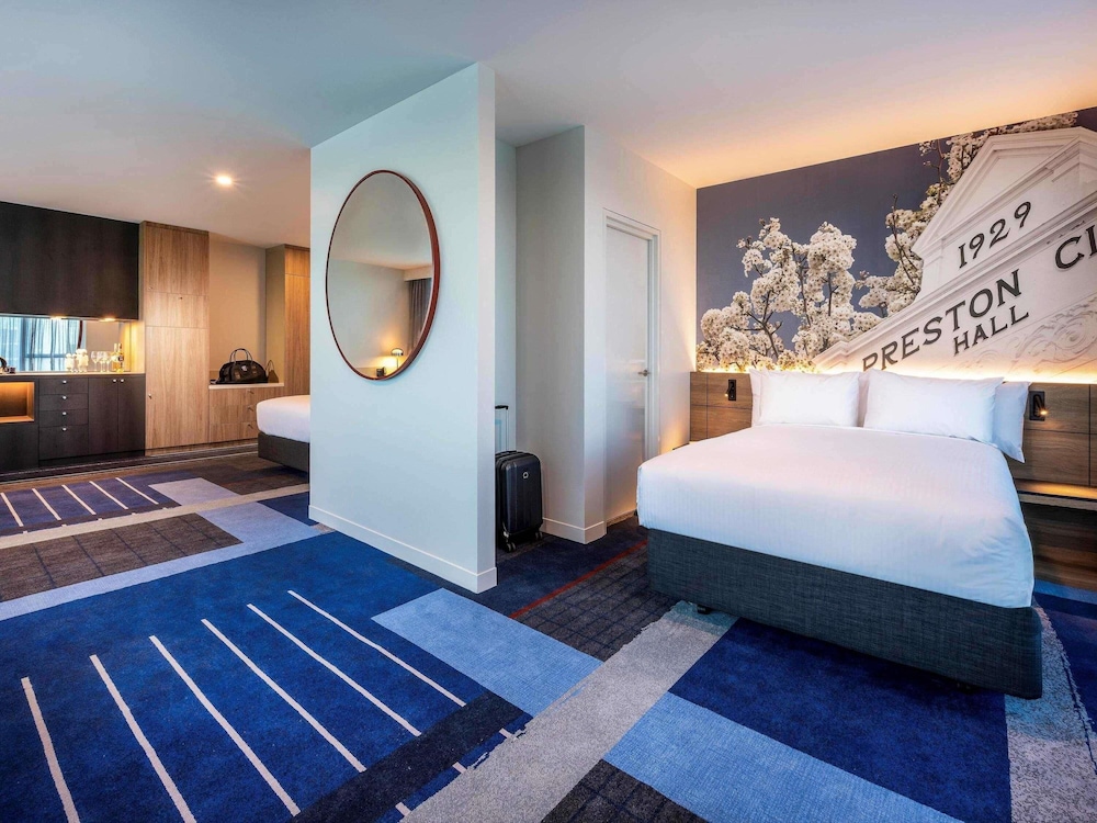 Habitación Deluxe con 2 camas dobles del hotel Novotel Melbourne Preston
