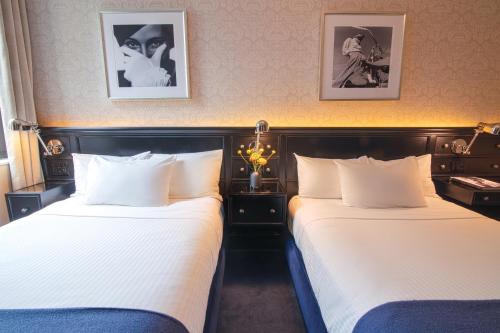 Estudio con 2 camas dobles del hotel The Frederick. Foto 1