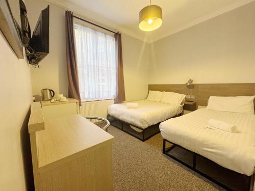 Habitación Triple del hotel Plaza hotel. Foto 5