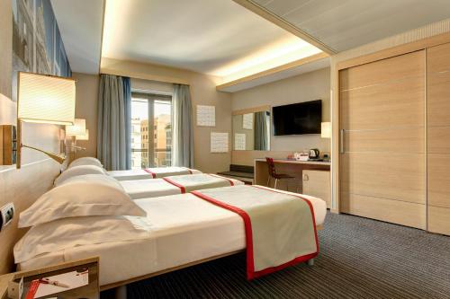 Habitación Triple Confort del hotel iQ Hotel Roma. Foto 4
