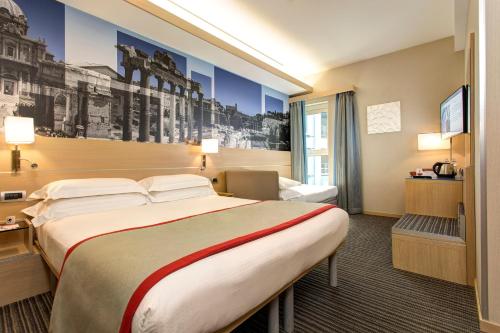 Habitación Triple del hotel iQ Hotel Roma. Foto 2