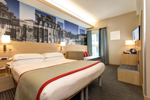Habitación Triple del hotel iQ Hotel Roma. Foto 3