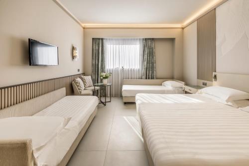 Habitación Cuádruple Deluxe del hotel Abacus. Foto 5