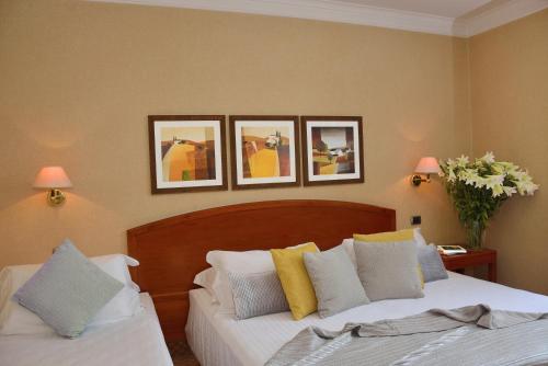 Habitación Triple del hotel LH Hotel Lloyd Roma. Foto 1