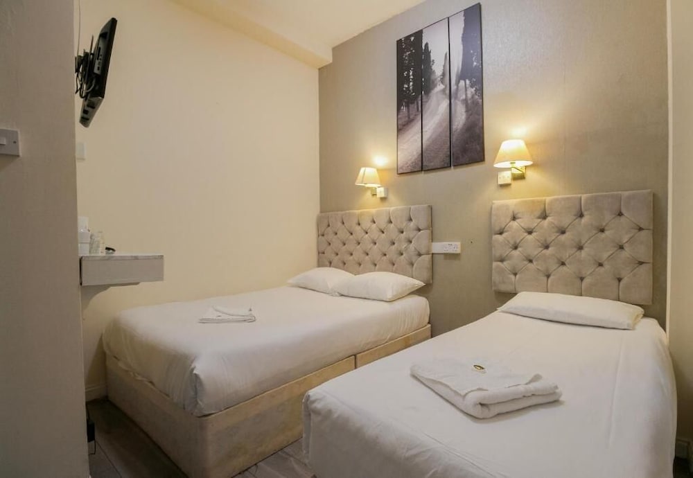 Habitación Triple del hotel Hyde Park Court