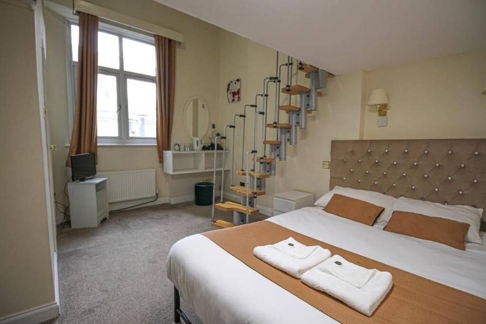 Habitación Cuádruple del hotel Hyde Park Court. Foto 7